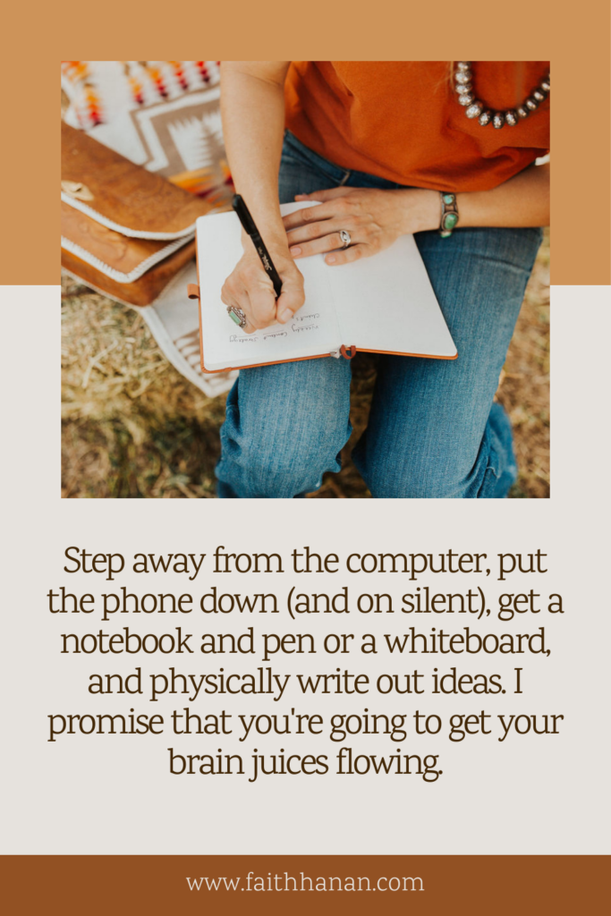 step-away-from-the-computer-when-struggling-to-write-website-copy-with-image-of-woman-sitting-on-hay-bales-writing-in-a-notebook-in-her-lap